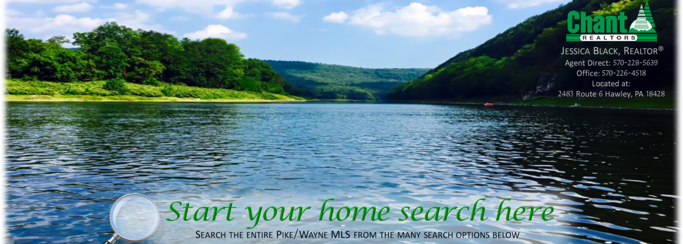 Scenic river landscape with green hills under a blue sky.